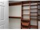 Spacious walk-in closet with wooden shelves and drawers offers ample storage space at 4001 Belmont Forest Way, Raleigh, NC 27606