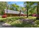 Exterior of brick home featuring a yard and back patio area at 4298 Old Stage S Rd, Erwin, NC 28339