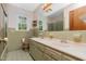 Nostalgic bathroom showcasing a double vanity, shower-tub combination, and vintage charm at 4298 Old Stage S Rd, Erwin, NC 28339