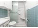 Bathroom featuring a toilet, shower, tiled wall, and built in cabinet at 4298 Old Stage S Rd, Erwin, NC 28339