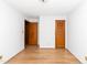 Clean bedroom featuring hardwood floors and doors at 4298 Old Stage S Rd, Erwin, NC 28339
