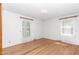 Bright bedroom with hardwood floors, natural light from two windows, and neutral paint at 4298 Old Stage S Rd, Erwin, NC 28339