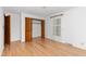 Bedroom with hardwood floors, a closet, a door and a window to let in natural light at 4298 Old Stage S Rd, Erwin, NC 28339