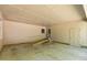 Spacious garage interior featuring a ramp, multiple doors, and windows, providing versatile use and accessibility at 4298 Old Stage S Rd, Erwin, NC 28339