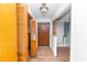 Hallway featuring hardwood floors, wood doors, and natural light through a large window at 4298 Old Stage S Rd, Erwin, NC 28339