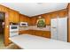 Bright kitchen with wood cabinets, modern appliances, and ample counter space for cooking at 4298 Old Stage S Rd, Erwin, NC 28339