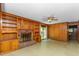 Inviting living room with wood accents, brick fireplace, and a sliding door with backyard views at 4298 Old Stage S Rd, Erwin, NC 28339