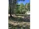 Exterior view of the home on a tree covered lot with a yard at 4501 Duraleigh Rd, Raleigh, NC 27612