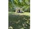 Exterior view of home with chairs on a covered porch and a grassy yard at 4501 Duraleigh Rd, Raleigh, NC 27612