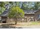 A charming back deck extends from the home, surrounded by lush trees and natural beauty at 500 W Woodcroft Pkwy # 13D, Durham, NC 27713