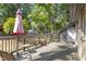 Enjoy the spacious wooden deck, ideal for outdoor relaxation and entertaining amidst lush greenery at 500 W Woodcroft Pkwy # 13D, Durham, NC 27713