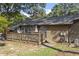 Featuring a wooden deck, brick exterior, and peaceful outdoor setting at 500 W Woodcroft Pkwy # 13D, Durham, NC 27713