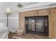 Close-up view of a brick fireplace in a cozy living room setting at 500 W Woodcroft Pkwy # 13D, Durham, NC 27713