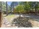 Landscaped front yard featuring a young tree and stepping stones at 500 W Woodcroft Pkwy # 13D, Durham, NC 27713