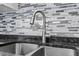 Stainless steel sink, granite countertops and stylish backsplash at 500 W Woodcroft Pkwy # 13D, Durham, NC 27713
