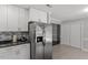 Kitchen with stainless steel refrigerator and pantry at 500 W Woodcroft Pkwy # 13D, Durham, NC 27713