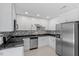 Modern kitchen with stainless steel appliances, sleek countertops, and plenty of storage at 500 W Woodcroft Pkwy # 13D, Durham, NC 27713