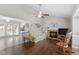 Comfortable living room featuring a fireplace, rocking chair and open floor plan at 500 W Woodcroft Pkwy # 13D, Durham, NC 27713