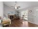 Cozy living room showcasing a fireplace, rocking chair, and a bright, airy feel at 500 W Woodcroft Pkwy # 13D, Durham, NC 27713