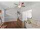 Open-concept living room with hardwood floors and easy access to other rooms at 500 W Woodcroft Pkwy # 13D, Durham, NC 27713