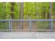 Wood deck with backyard view, ideal for outdoor relaxation at 500 W Woodcroft Pkwy # 17C, Durham, NC 27713