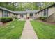 Charming home with brick exterior, landscaped yard, and accessible entryway at 500 W Woodcroft Pkwy # 17C, Durham, NC 27713