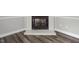 Cozy fireplace with painted brick surround and stylish hearth; new floor at 500 W Woodcroft Pkwy # 17C, Durham, NC 27713