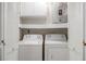 Laundry room features washer, dryer, storage cabinet and shelving at 500 W Woodcroft Pkwy # 17C, Durham, NC 27713