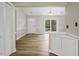 Welcoming living room with wood-look flooring and a front door entrance at 500 W Woodcroft Pkwy # 17C, Durham, NC 27713