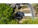 Overhead view of a new home with a driveway and lush surroundings, located in a tranquil residential area at 5022 Mockingbird Ln, Sanford, NC 27332