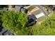 High-angle shot of a newly built home with driveway access and proximity to mature trees in a peaceful community at 5022 Mockingbird Ln, Sanford, NC 27332