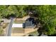 Overhead shot of a two-story home in a wooded setting, featuring a driveway and proximity to neighborhood amenities at 5022 Mockingbird Ln, Sanford, NC 27332