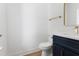 Powder room with navy blue vanity, gold hardware, a white countertop, and modern fixtures at 5022 Mockingbird Ln, Sanford, NC 27332