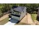 View of a newly constructed two-story home with gray siding and a two car garage at 5022 Mockingbird Ln, Sanford, NC 27332