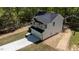 Modern two-story home with a spacious two-car garage, showcasing contemporary design in a lush, wooded setting at 5022 Mockingbird Ln, Sanford, NC 27332