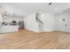 Spacious living room with hardwood floors, an open layout, and stairs to the second floor at 5022 Mockingbird Ln, Sanford, NC 27332