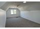 Spacious carpeted bonus room with a ceiling fan and a window overlooking the neighborhood at 520 S Lincoln St, Benson, NC 27504
