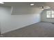 Bright bonus room with recessed lighting, ceiling fan, and large window with neighborhood view at 520 S Lincoln St, Benson, NC 27504
