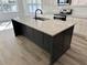Kitchen view showcasing a large island with granite countertop and black base at 520 S Lincoln St, Benson, NC 27504