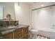 Stylish bathroom with marble countertop vanity, subway tile shower, and rustic floor tiles at 5265 Aleppo Ln, Raleigh, NC 27613
