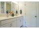 Bright bathroom featuring a dual sink vanity, stylish fixtures, and modern finishes at 5265 Aleppo Ln, Raleigh, NC 27613
