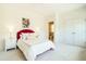 Cozy bedroom with plush carpet, stylish furniture, and ensuite bathroom access at 5265 Aleppo Ln, Raleigh, NC 27613