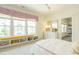 Sun-filled bedroom with a cozy window seat, natural light, and bright accents at 5265 Aleppo Ln, Raleigh, NC 27613