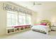 Charming bedroom featuring a cozy window seat, bright decor, and ample natural light at 5265 Aleppo Ln, Raleigh, NC 27613