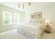 Bright bedroom with large windows, pendant lighting, and neutral decor create a relaxing atmosphere at 5265 Aleppo Ln, Raleigh, NC 27613