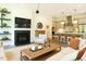 Living room that blends into a kitchen that features modern finishes, an open layout, and great natural light at 5265 Aleppo Ln, Raleigh, NC 27613