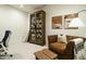 Inviting living room with leather chair, unique cabinet, and neutral artwork creating a cozy space at 5265 Aleppo Ln, Raleigh, NC 27613