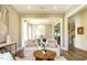 Inviting space with comfortable seating, stylish decor, and a view into the adjacent dining area at 5265 Aleppo Ln, Raleigh, NC 27613