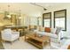 Open-concept living room and kitchen featuring modern decor, hardwood floors, and plenty of natural light at 5265 Aleppo Ln, Raleigh, NC 27613