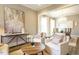 Cozy living room featuring a stylish round table, plush chairs, and an adjacent dining area at 5265 Aleppo Ln, Raleigh, NC 27613